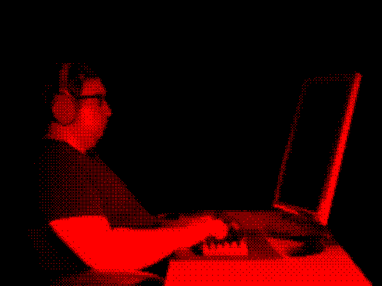 Dithered image of me working at a computer